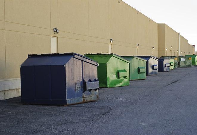 several large trash cans setup for proper construction site cleanup in Beaver Dam, WI